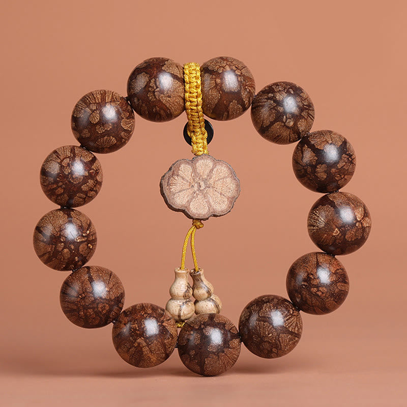 Bracelet de paix intérieure en bois de fleur de prunier et Buddha Stones