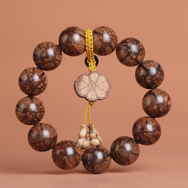 Bracelet de paix intérieure en bois de fleur de prunier et Buddha Stones