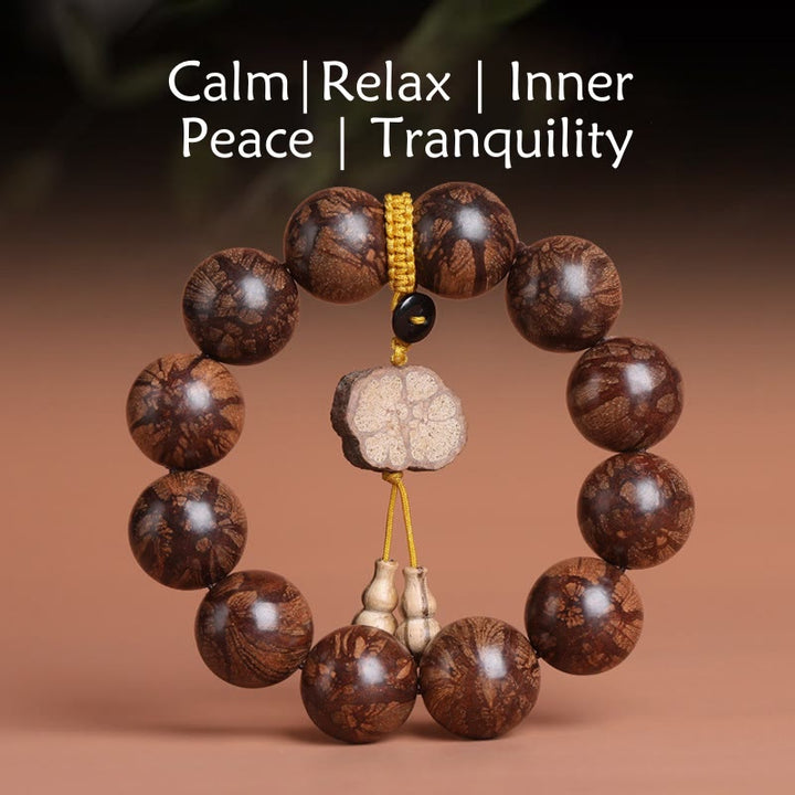 Bracelet de paix intérieure en bois de fleur de prunier et Buddha Stones