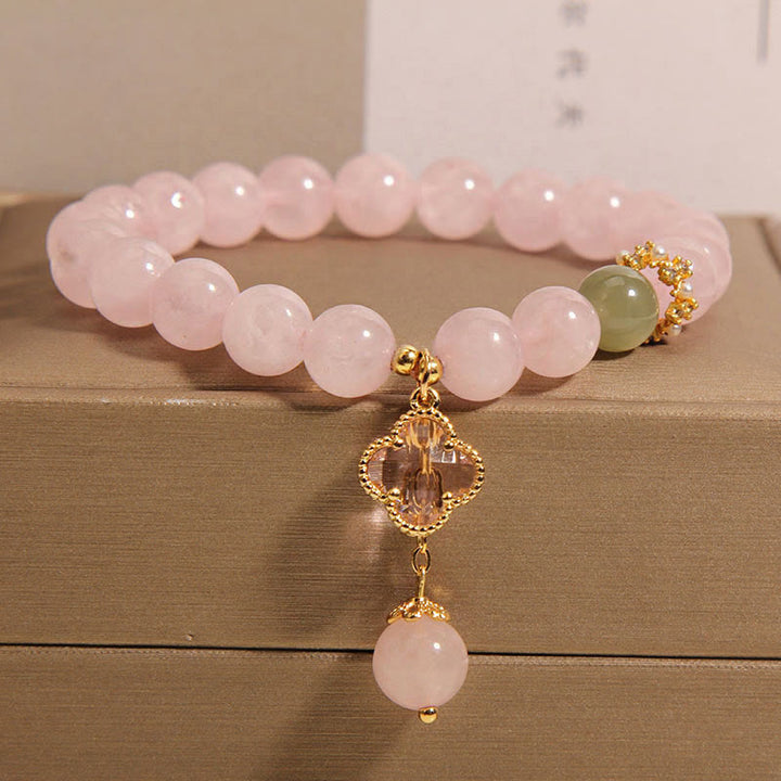Bracelet apaisant en cristal rose naturel avec trèfle à quatre feuilles de Buddha Stones