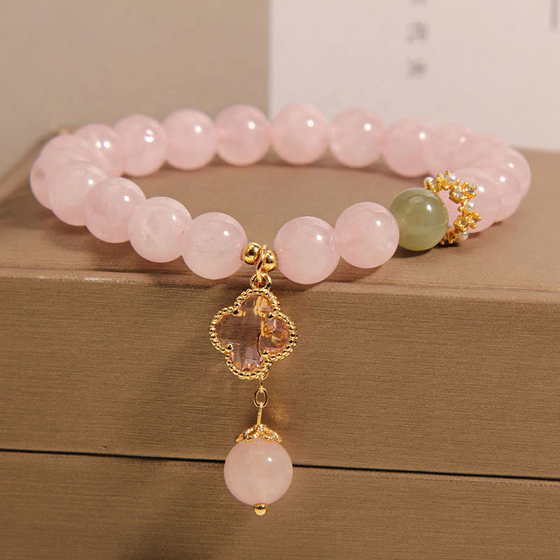 Bracelet apaisant en cristal rose naturel avec trèfle à quatre feuilles de Buddha Stones - image 1