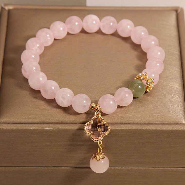 Bracelet apaisant en cristal rose naturel avec trèfle à quatre feuilles de Buddha Stones