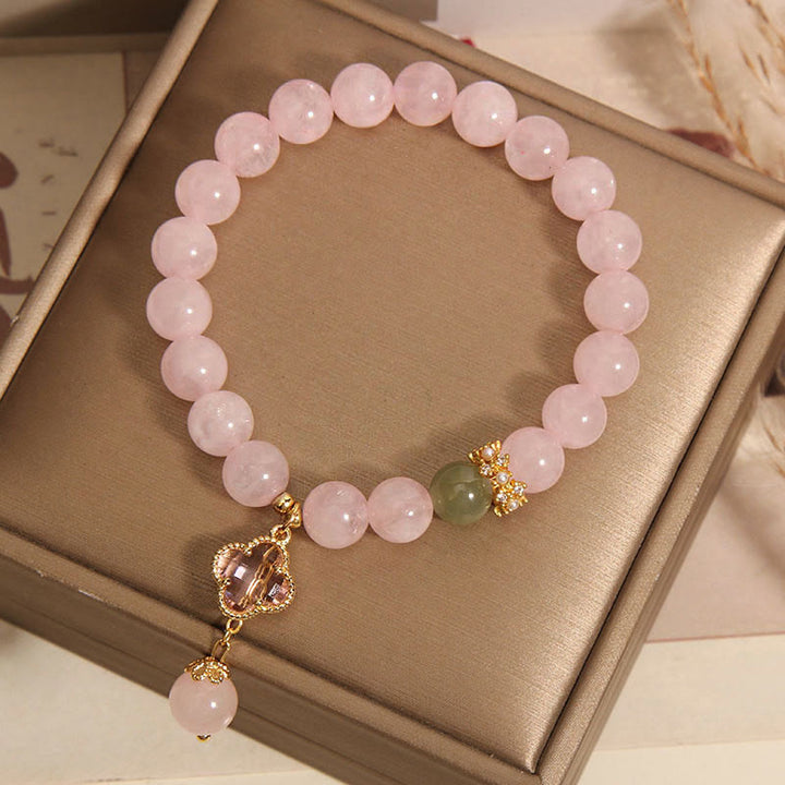 Bracelet apaisant en cristal rose naturel avec trèfle à quatre feuilles de Buddha Stones