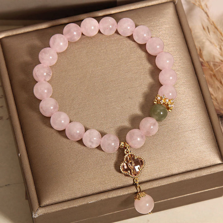 Bracelet apaisant en cristal rose naturel avec trèfle à quatre feuilles de Buddha Stones