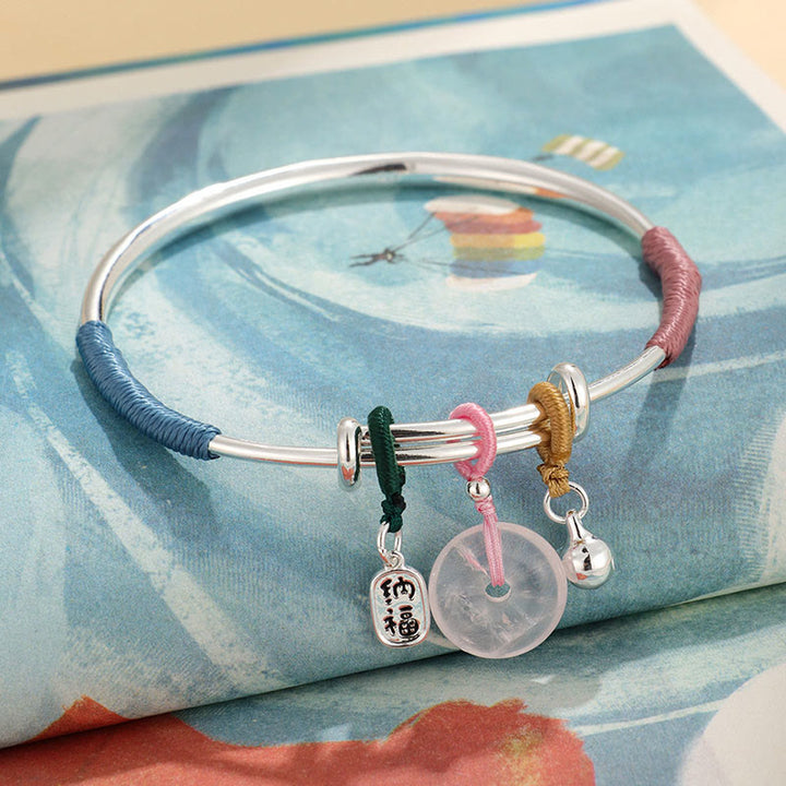 Bracelet jonc avec boucle de paix en cristal rose et Buddha Stones