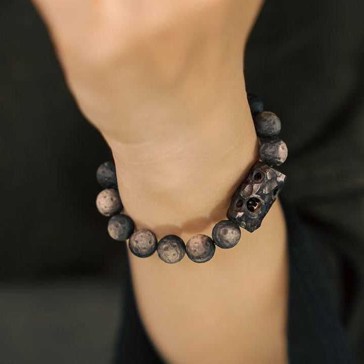 Bracelet apaisant en bois d'ébène et obsidienne argentée avec Buddha Stones