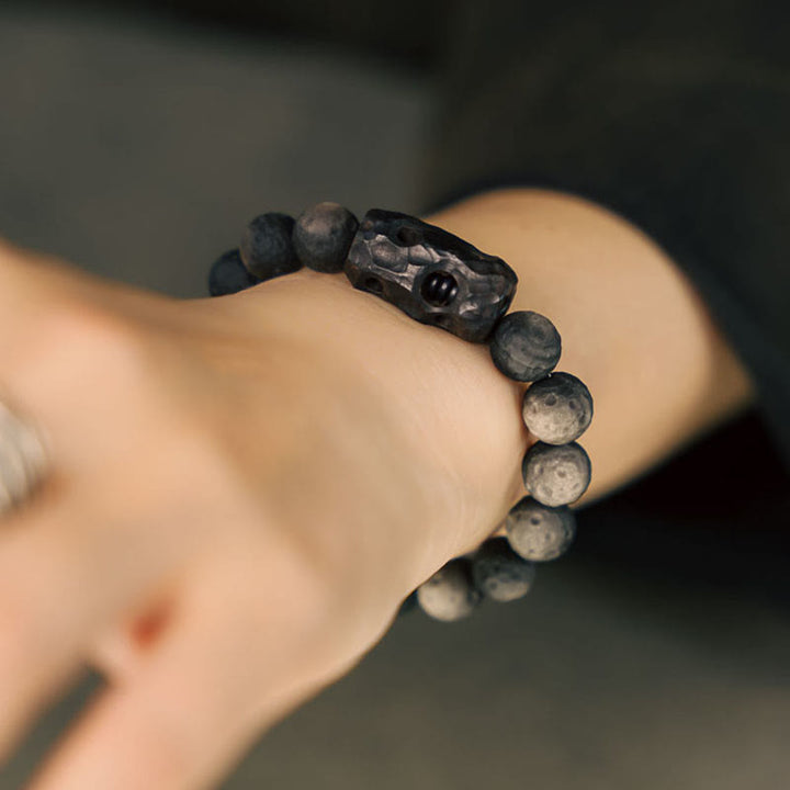 Bracelet apaisant en bois d'ébène et obsidienne argentée avec Buddha Stones