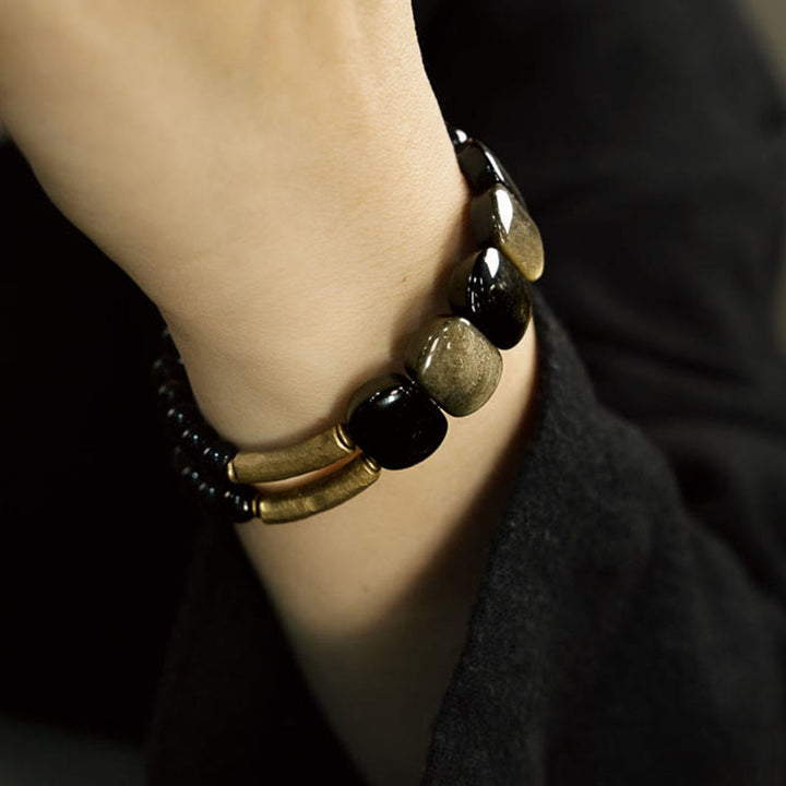 Bracelet renforcé en obsidienne noire et dorée avec Buddha Stones