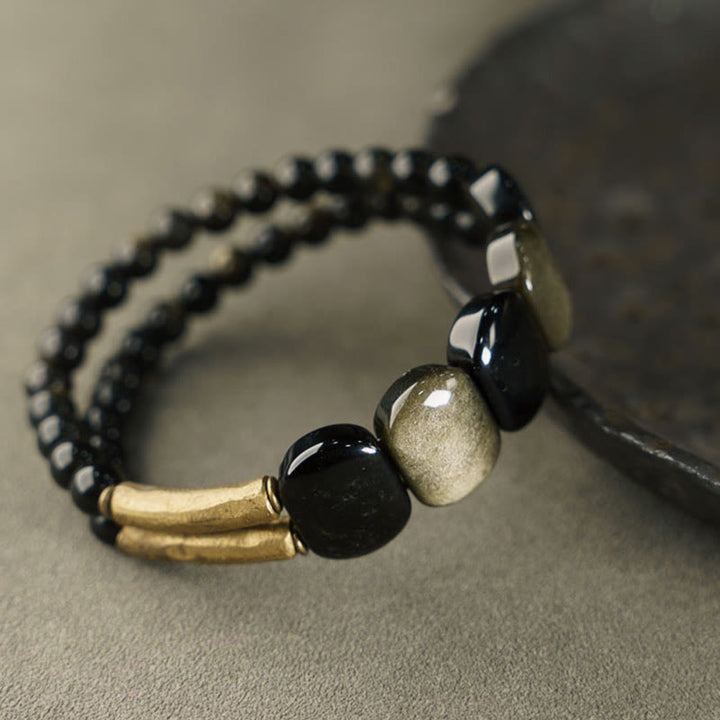 Bracelet renforcé en obsidienne noire et dorée avec Buddha Stones
