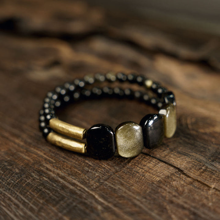 Bracelet renforcé en obsidienne noire et dorée avec Buddha Stones
