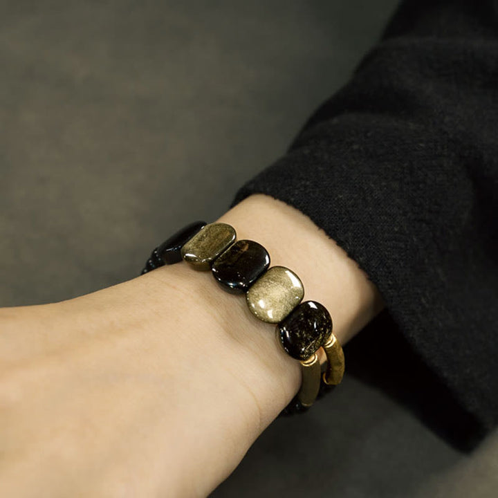 Bracelet renforcé en obsidienne noire et dorée avec Buddha Stones
