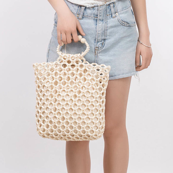 Sac à main en perles de bois creuses en maille tressée avec fil de pêche tissé à la main en Buddha Stones