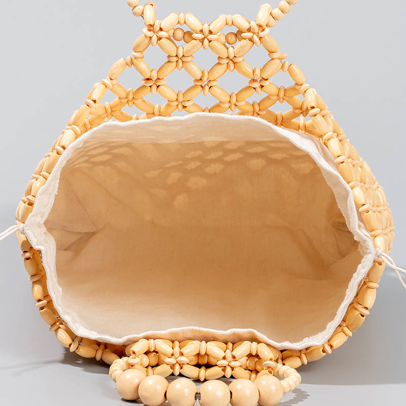 Sac à main en perles de bois creuses en maille tressée avec fil de pêche tissé à la main en Buddha Stones