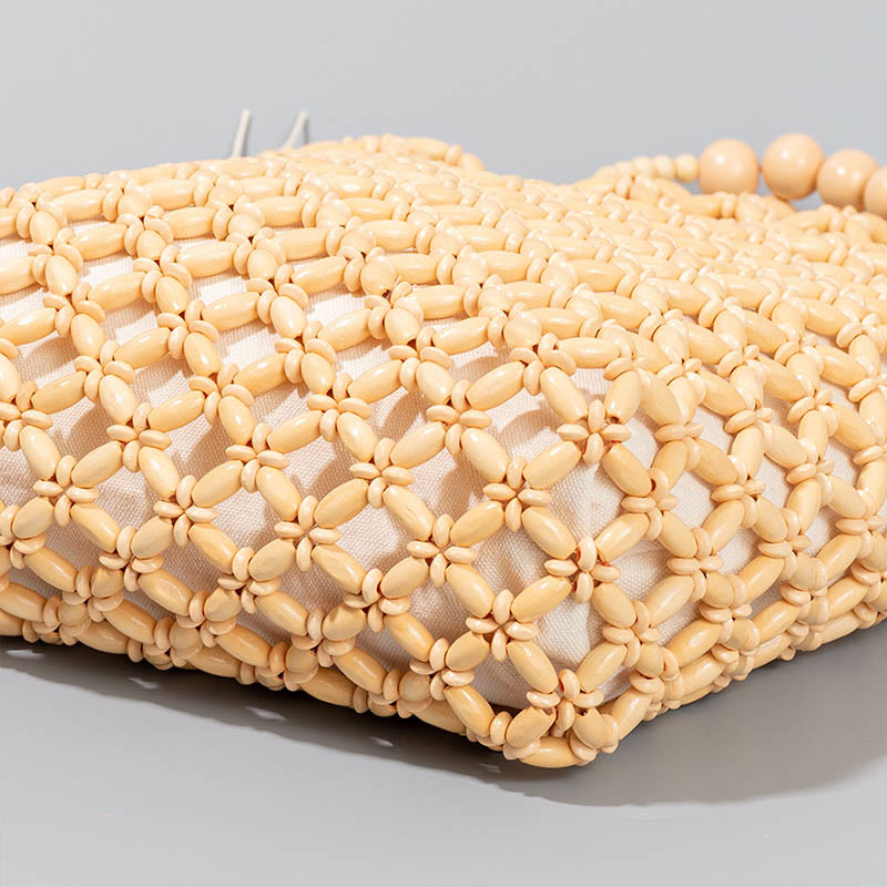 Sac à main en perles de bois creuses en maille tressée avec fil de pêche tissé à la main en Buddha Stones