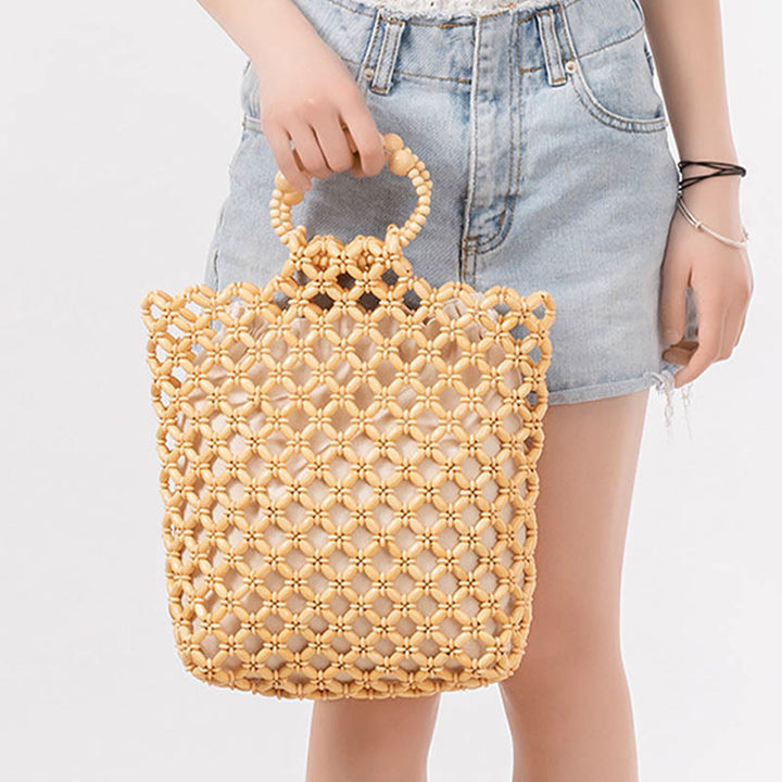 Sac à main en perles de bois creuses en maille tressée avec fil de pêche tissé à la main en Buddha Stones