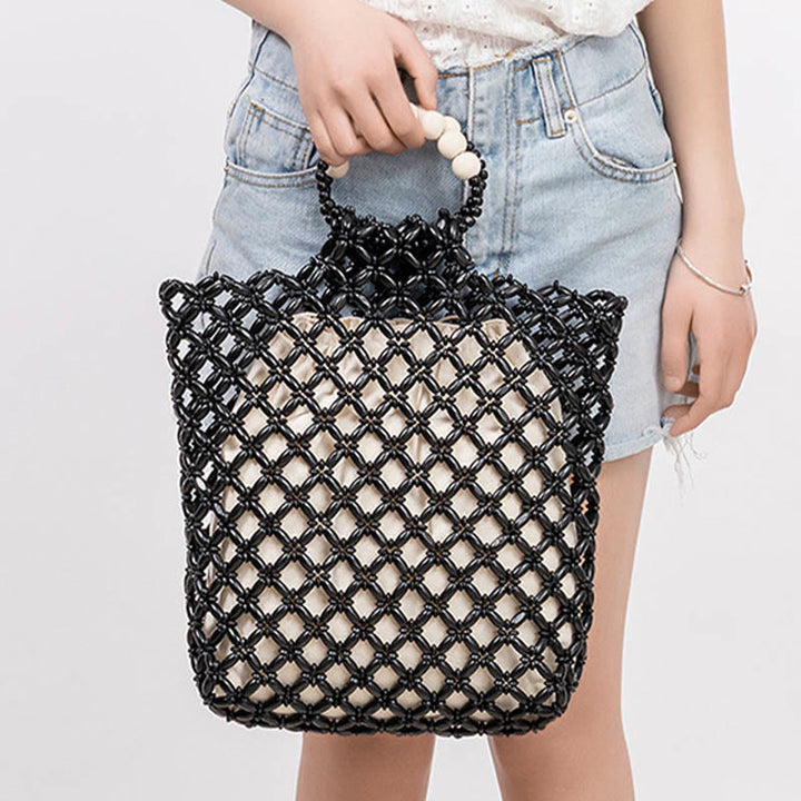 Sac à main en perles de bois creuses en maille tressée avec fil de pêche tissé à la main en Buddha Stones