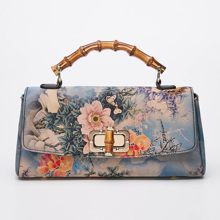 Sac à main à bandoulière avec chaîne en métal et poignée en bambou et motif floral Buddha Stones