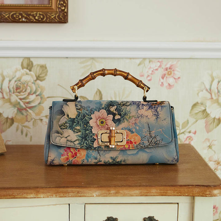 Sac à main à bandoulière avec chaîne en métal et poignée en bambou et motif floral Buddha Stones