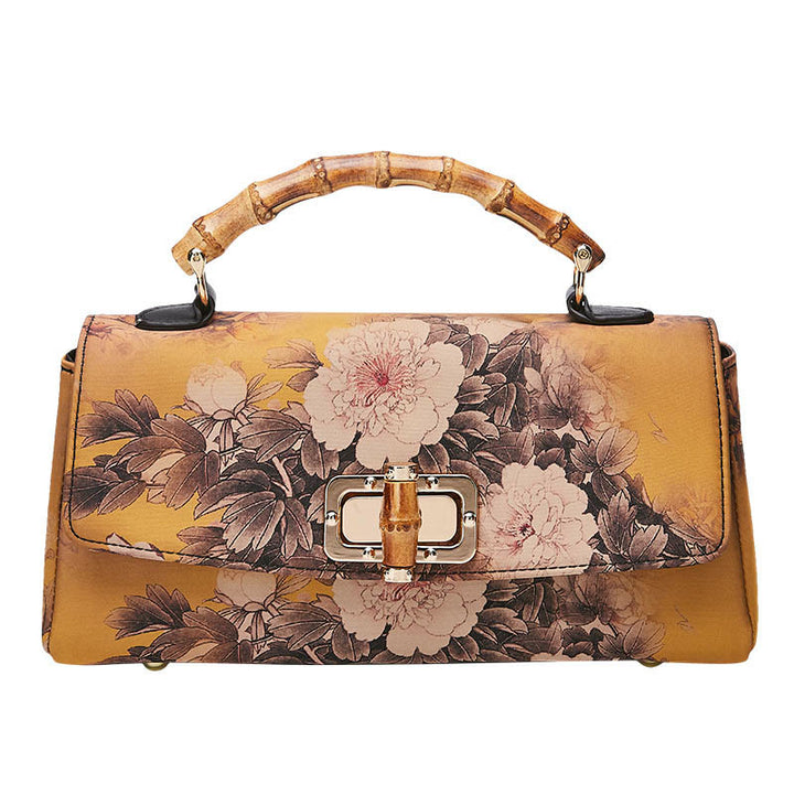 Sac à main à bandoulière avec chaîne en métal et poignée en bambou et motif floral Buddha Stones