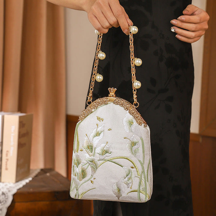 Sac à main avec poignée en métal et broderie Buddha Stones Calla