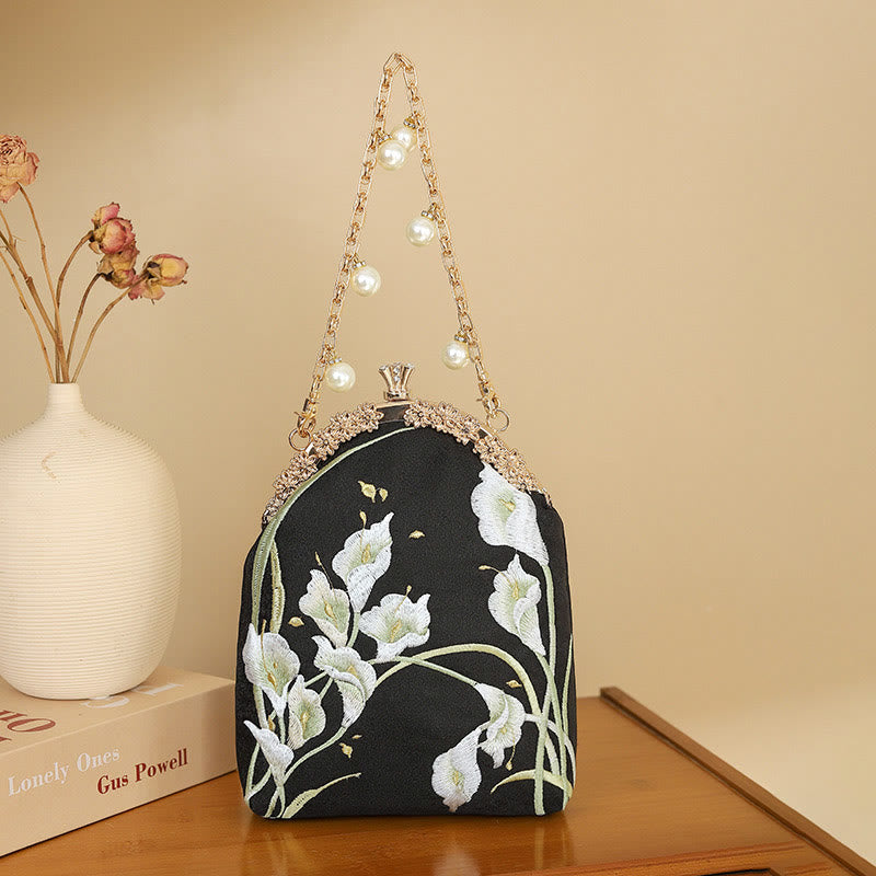 Sac à main avec poignée en métal et broderie Buddha Stones Calla