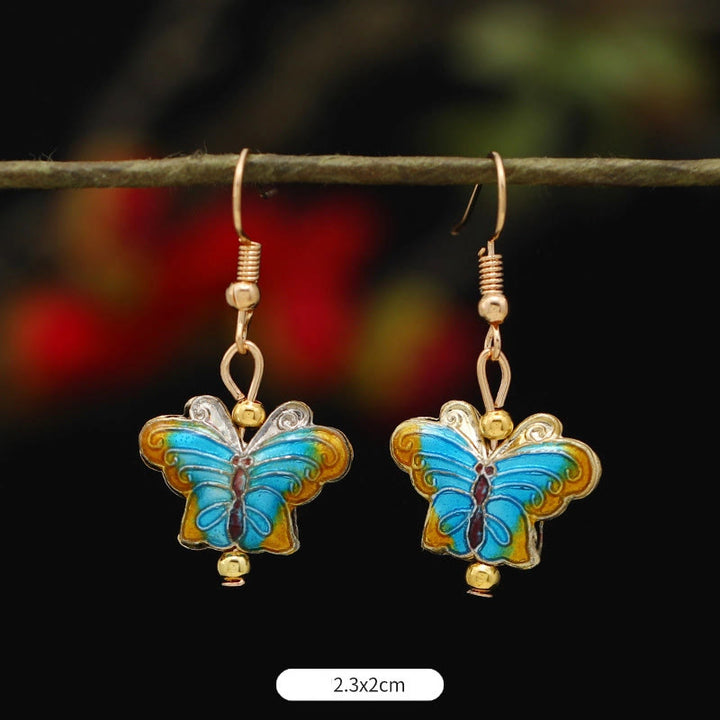 Boucles d'oreilles pendantes en alliage de cuivre avec Buddha Stones, fleur de lotus et papillon