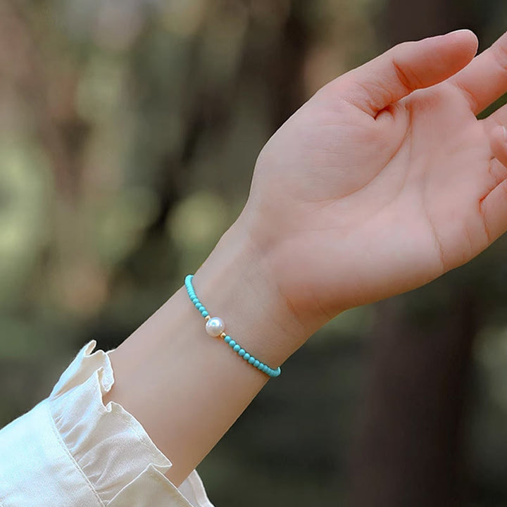 Bracelet de protection en petites perles d'agate rouge turquoise Buddha Stones