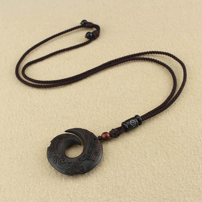 Buddha Stones d'ébène Bois de santal La chance améliore le motif de conception Collier pendentif de paix