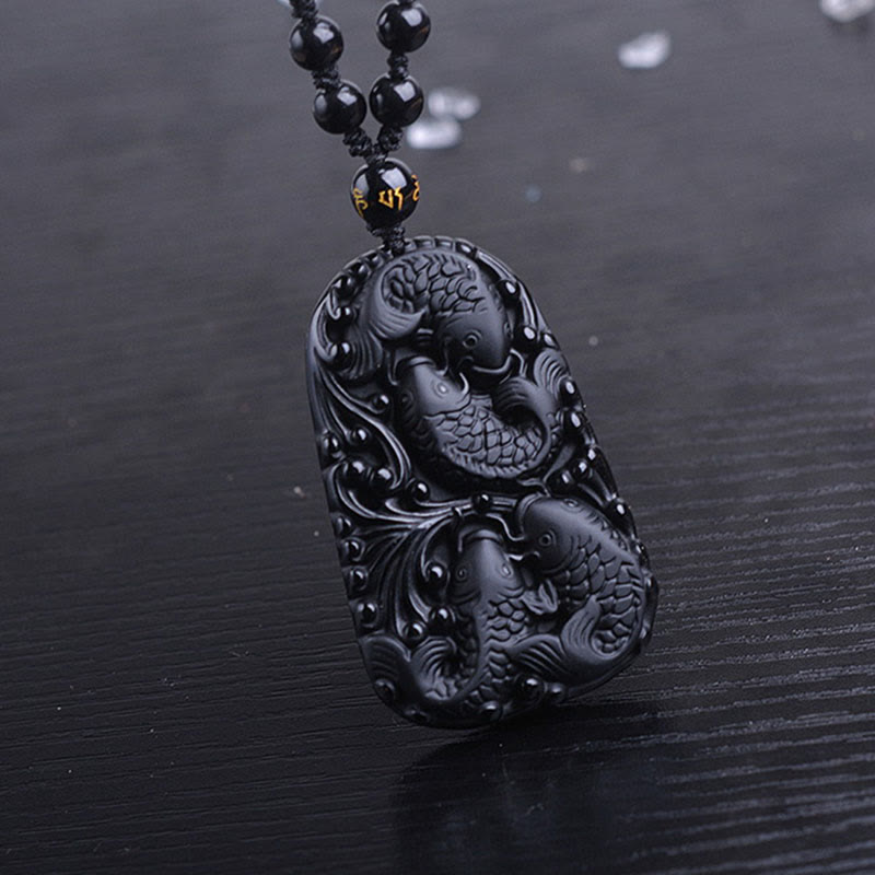 Collier avec pendentif en perles de force gravées en obsidienne noire et poisson Koi de Buddha Stones - image 15