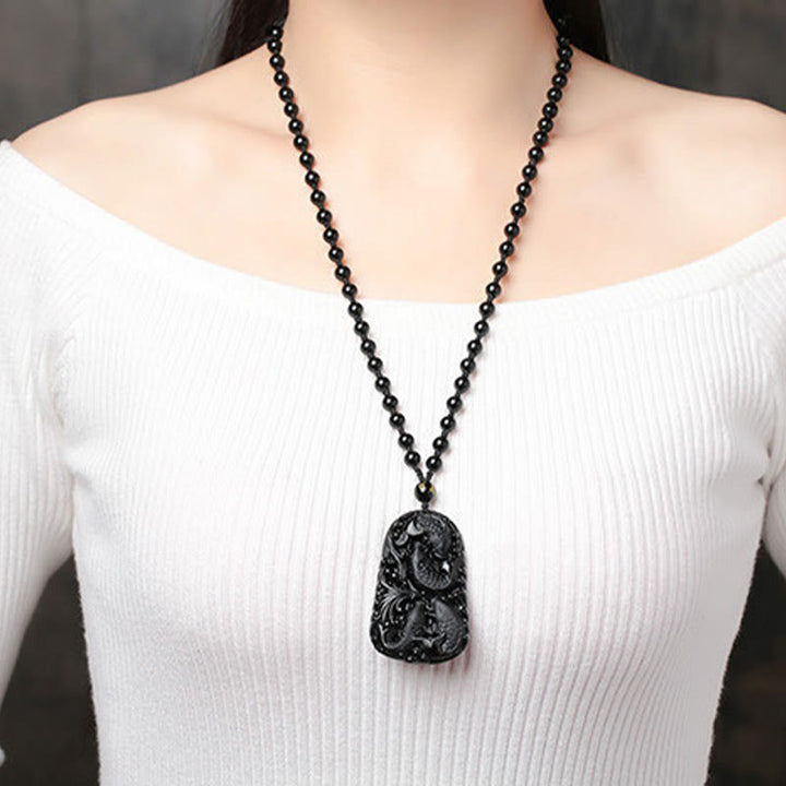 Collier avec pendentif en perles de force gravées en obsidienne noire et poisson Koi de Buddha Stones - image 19