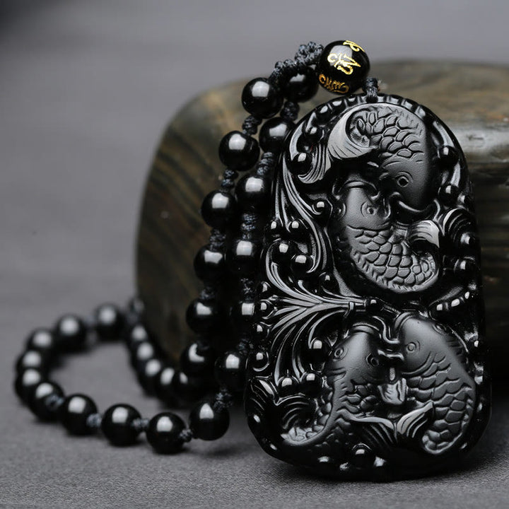 Collier avec pendentif en perles de force gravées en obsidienne noire et poisson Koi de Buddha Stones - image 4