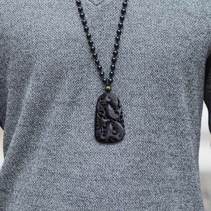 Collier avec pendentif en perles de force gravées en obsidienne noire et poisson Koi de Buddha Stones - image 17