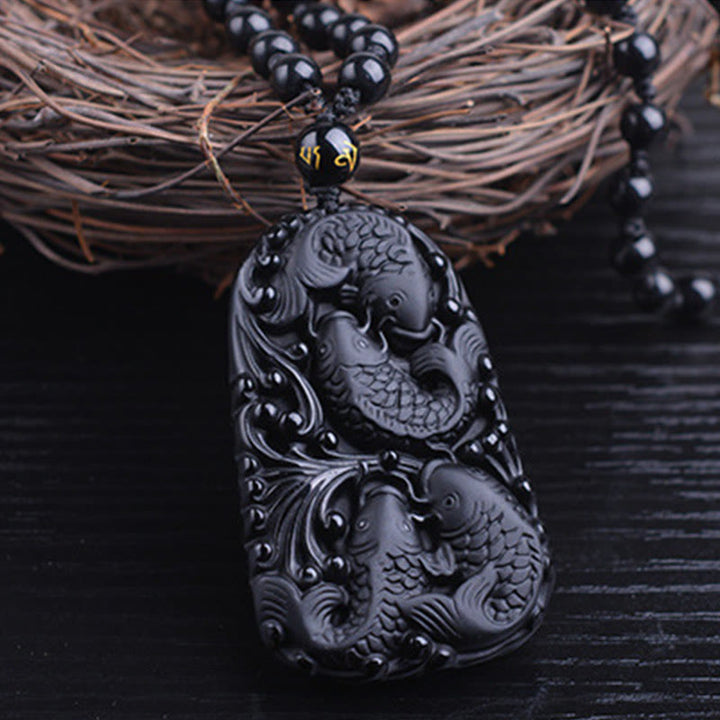 Collier avec pendentif en perles de force gravées en obsidienne noire et poisson Koi de Buddha Stones - image 12
