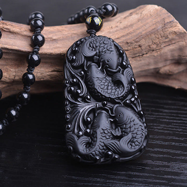 Collier avec pendentif en perles de force gravées en obsidienne noire et poisson Koi de Buddha Stones - image 13