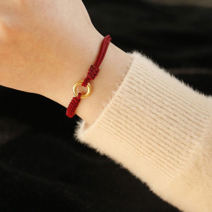 Bracelet en fil rouge avec boucle de paix et Buddha Stones