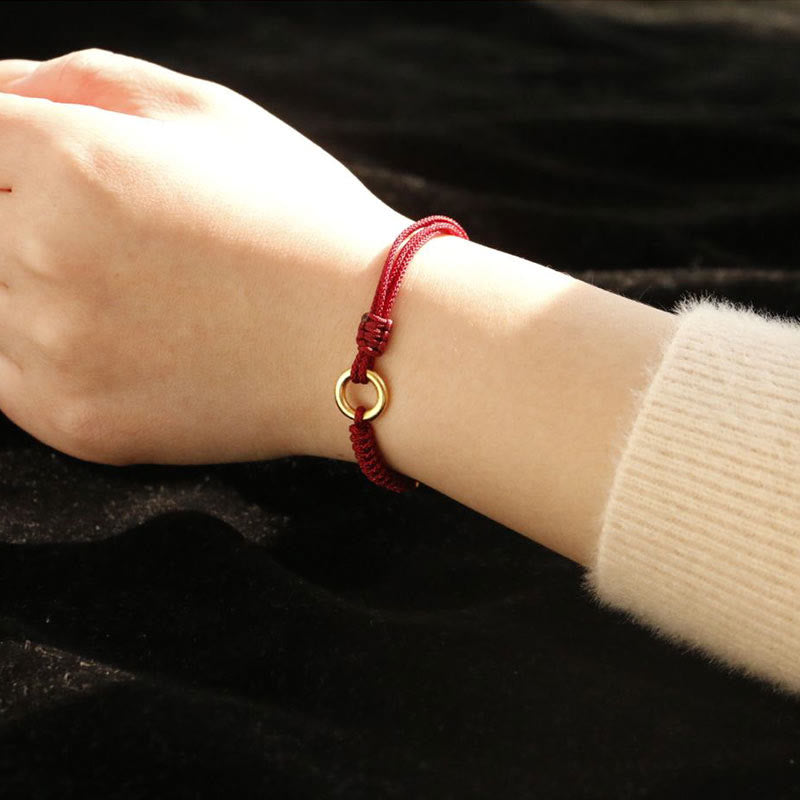 Bracelet en fil rouge avec boucle de paix et Buddha Stones