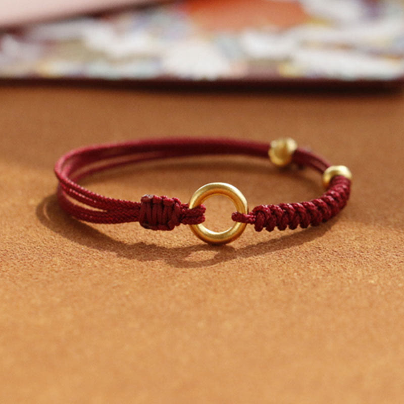 Bracelet en fil rouge avec boucle de paix et Buddha Stones