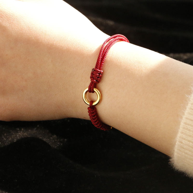 Bracelet en fil rouge avec boucle de paix et Buddha Stones