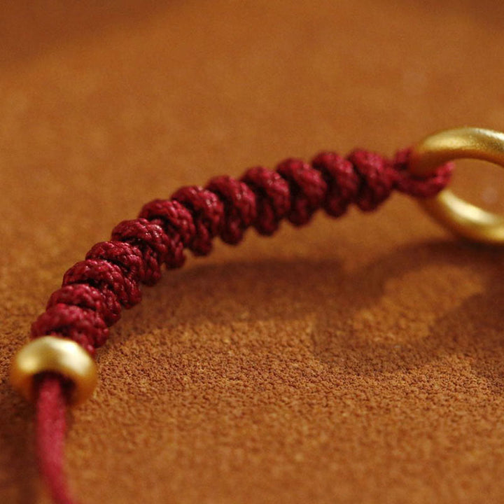 Bracelet en fil rouge avec boucle de paix et Buddha Stones