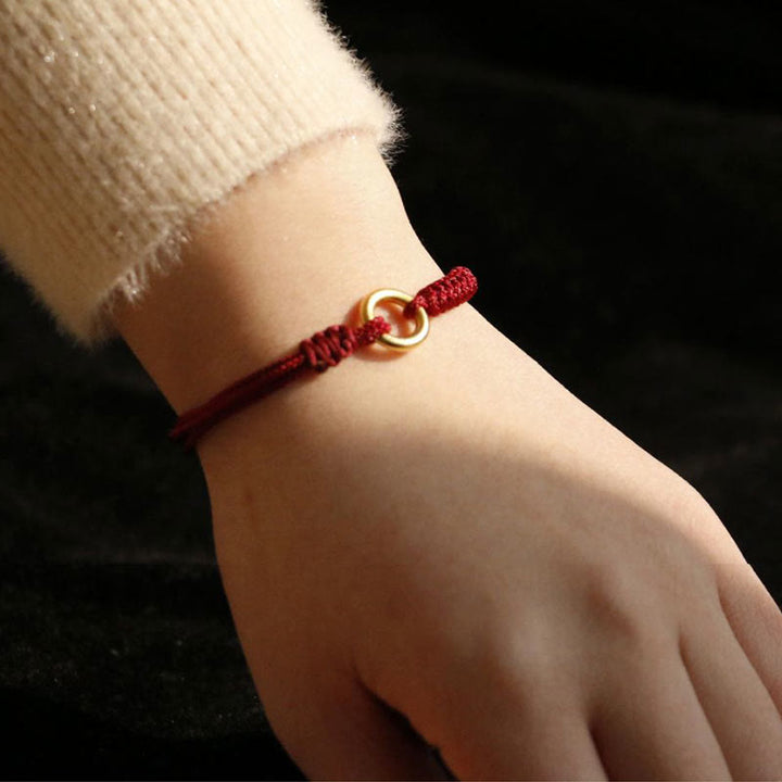 Bracelet en fil rouge avec boucle de paix et Buddha Stones