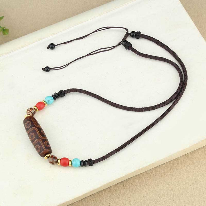 Buddha Stones Perle Dzi tibétaine à neuf yeux Perle Dzi à trois yeux Colliers de protection Pendentif
