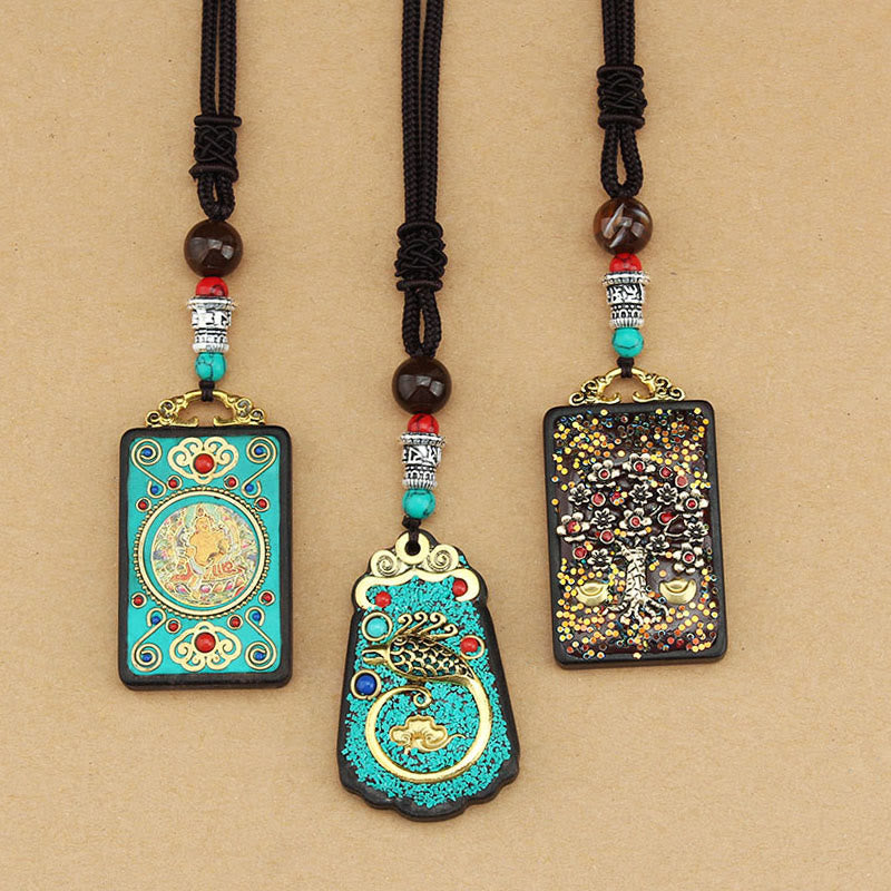 Buddha Stones Tibet Dieu de la richesse Arbre d'argent Phénix doré Thangka Collier pendentif en ébène pour la paix