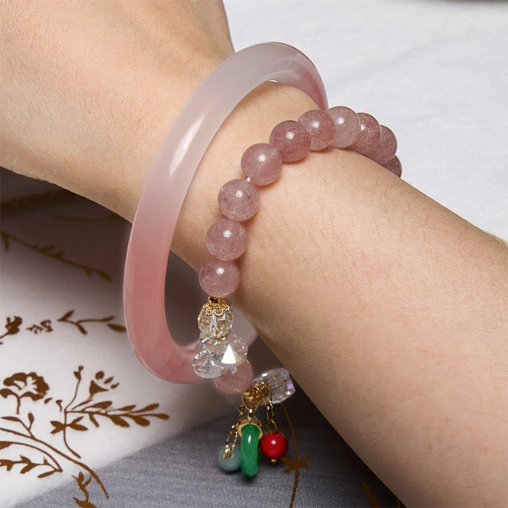 Bracelet rose avec Buddha Stones attirant l'amour et la protection