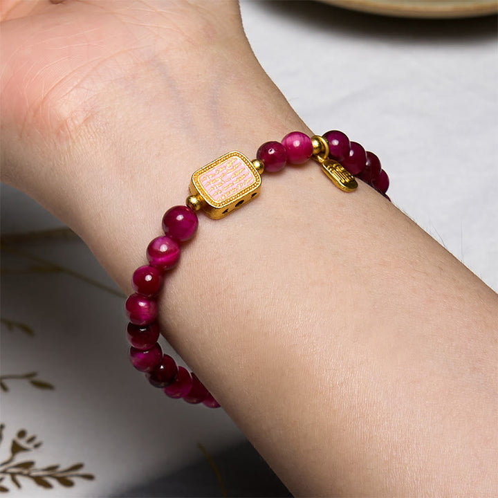 Bracelet de courage avec personnage Fu en œil de tigre rose et rouge Buddha Stones