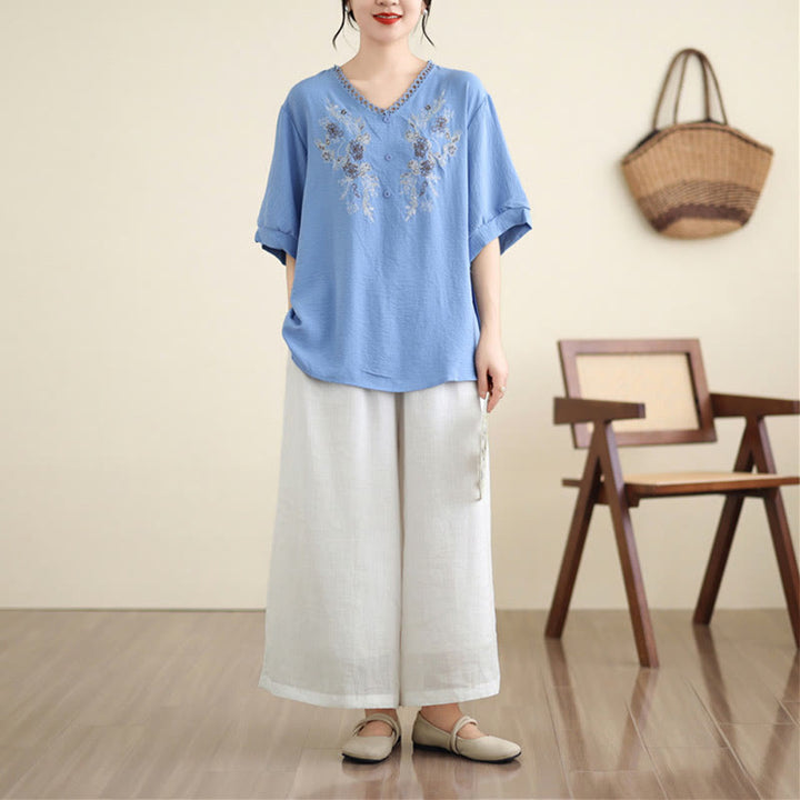 T-shirt à manches courtes et col en V avec broderie florale et Buddha Stones