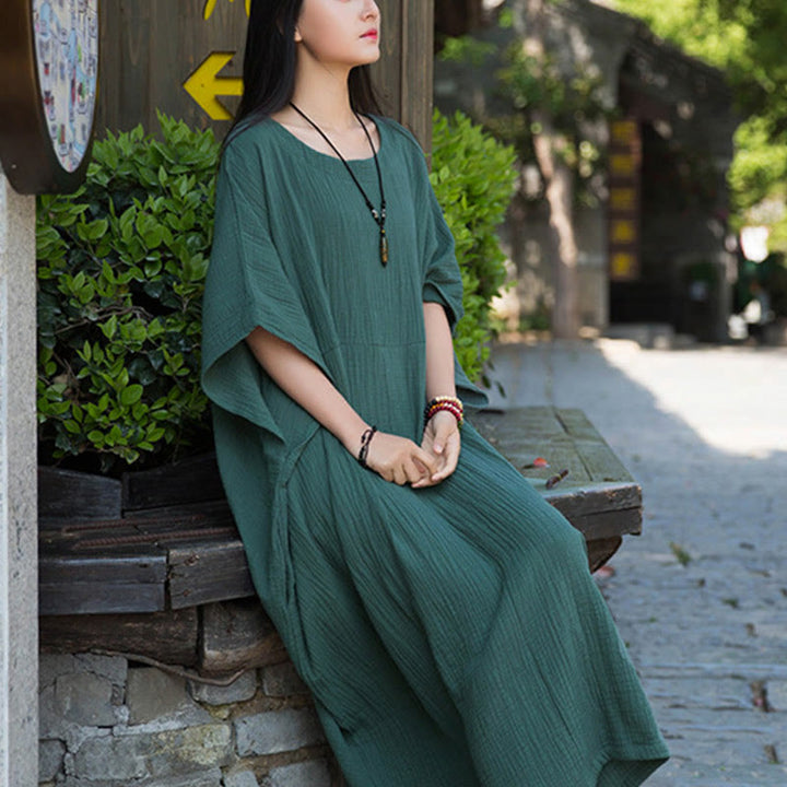 Robe longue ample à manches chauve-souris et poches de couleur unie avec Buddha Stones