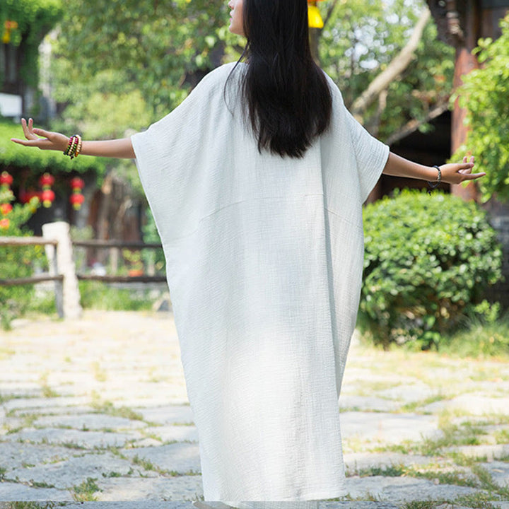Robe longue ample à manches chauve-souris et poches de couleur unie avec Buddha Stones
