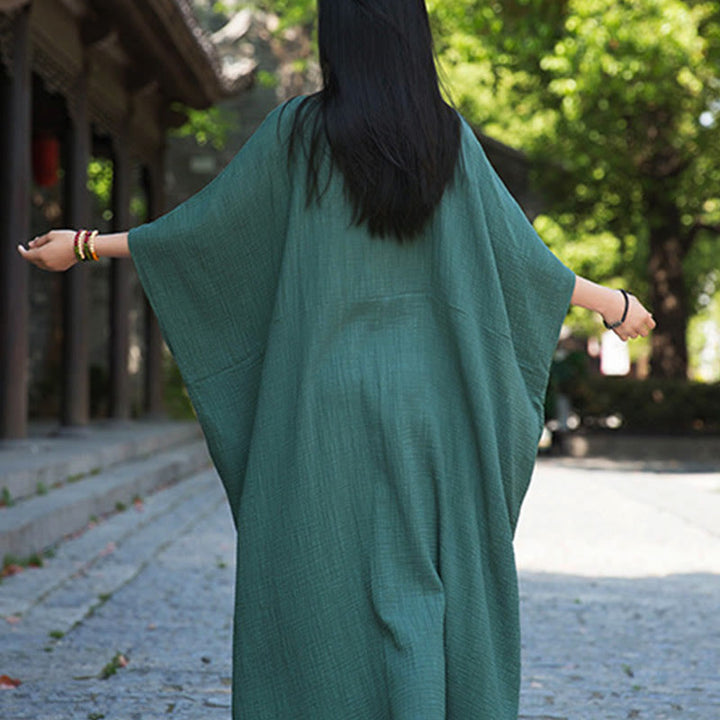 Robe longue ample à manches chauve-souris et poches de couleur unie avec Buddha Stones
