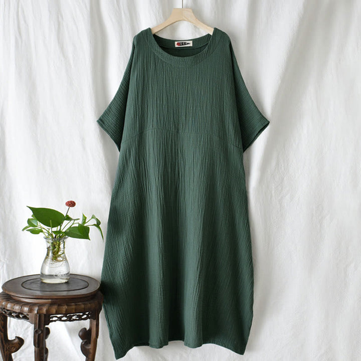 Robe longue ample à manches chauve-souris et poches de couleur unie avec Buddha Stones