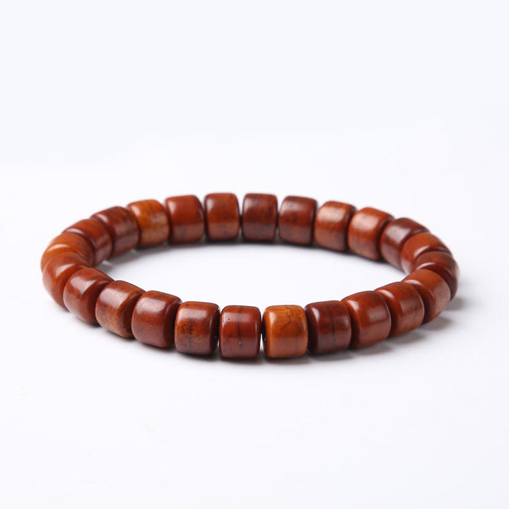 Bracelet de force en agate rouge et corne de mouton avec Buddha Stones d'os tibétaines et perles dzi à trois yeux